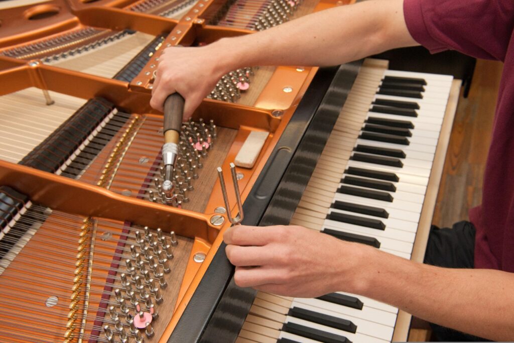 Professional piano tuning service performed by an experienced technician